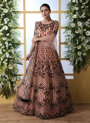 Sensational Peach Colored Soft Net Base Festive Wear Designer Gown